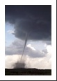 The building in the foreground is not in danger as the tornado is over a mile farther away.