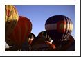 Colorado's state flag emblazens this hot-air balloon amid others in this balloon festival.