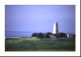 This lighthouse won't be needed today with such tranquil seas and clear skies.