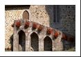 Hanging flower baskets adorn the wall of Chateaux de Val (15th Century).