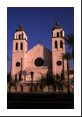 Azure sky serves as an excellent backdrop to the sunlit pink church in Phoenix.