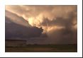 The next time Chicken-Little says the sky is falling, I might believe it. Low hanging mammatus clouds with rain and hail falling out of the back side of this summer thunderstorm (cumulonimbus).