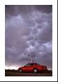 Mammatus clouds beneath a thunderstorm anvil while we chase in a vehicle with meteorological instruments used as part of the VORTEX project.