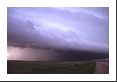 Many supercell thunderstorms dump copious rains and produce an outflow boundary with this roll cloud appearance spreading out ahead of the precipitation.