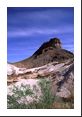 Billow clouds above a lunar-like landscape of rock in Big Bend Nat Park.