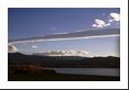 A rotor cloud often resembles a long cigar and is oriented parallel to the mountain ridge - it is also very possible that any aircraft flying through one (or nearby) may experience some rough turbulence.