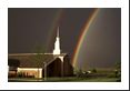 Perhaps the best primary rainbow I've ever seen made impressive by the very dark skies behind as well as the church (Latter-Day Saints). The secondary bow is also quite obvious to the left of the church steeple.